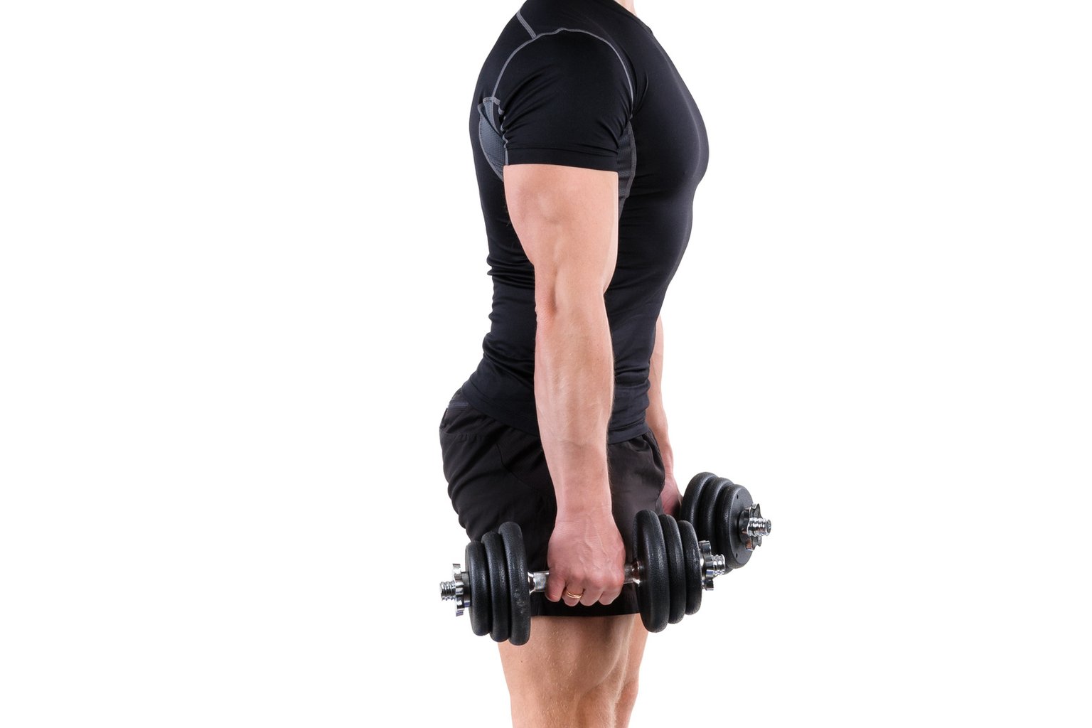 A person performing a standing dumbbell calf raise with controlled form