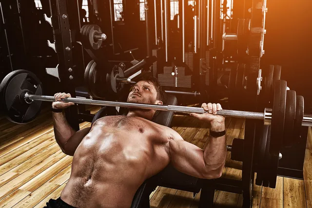 Athlete performing a barbell bench press