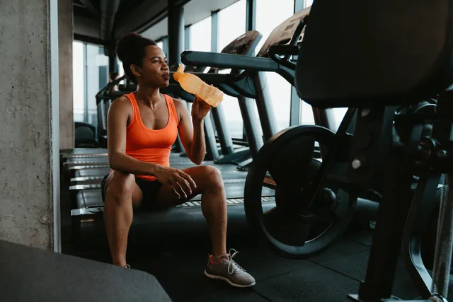 Athlete taking a brief water break during a workout
