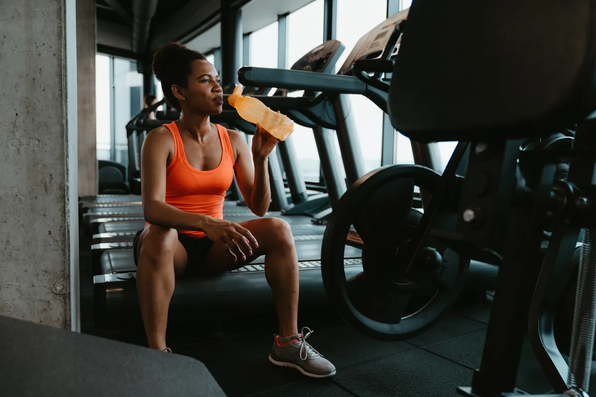 Athlete taking a brief water break during a workout