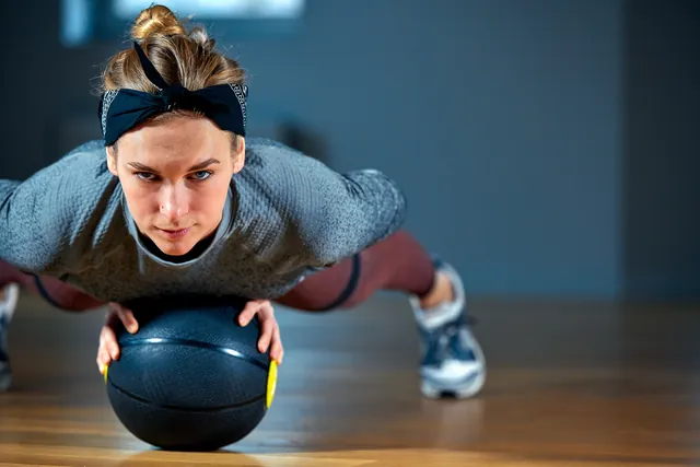 Athlete performing an intense kettlebell interval